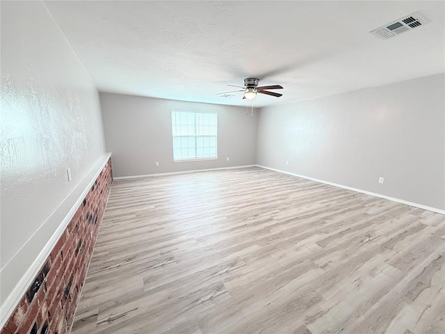 402 E 6th St, Amber, OK 73004 - spare room with a ceiling fan, light wood-style floors, and baseboards