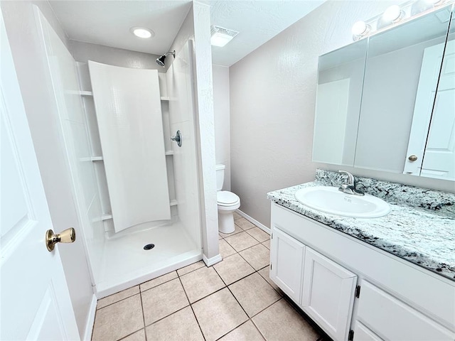 402 E 6th St, Amber, OK 73004 - bathroom featuring vanity, toilet, a shower stall, and tile patterned flooring