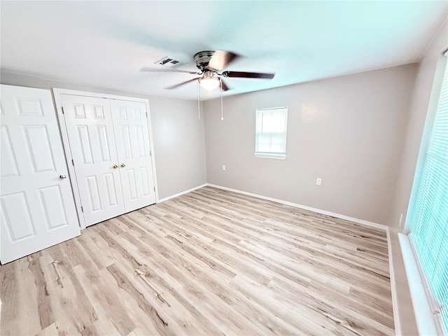 402 E 6th St, Amber, OK 73004 - unfurnished bedroom featuring light wood finished floors, a closet, baseboards, and ceiling fan