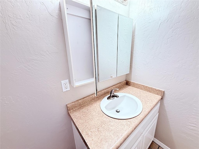 402 E 6th St, Amber, OK 73004 - bathroom with vanity and a textured wall