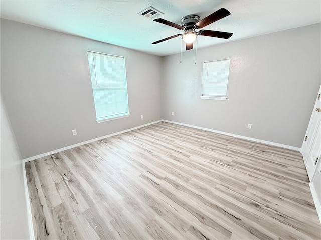 402 E 6th St, Amber, OK 73004 - unfurnished room featuring light wood-style flooring, a ceiling fan, and baseboards