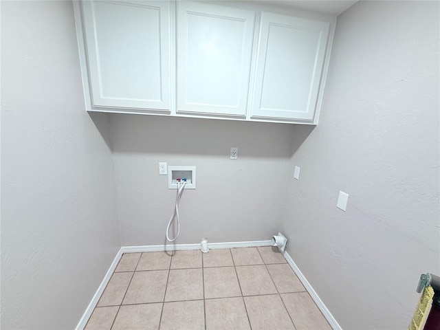 402 E 6th St, Amber, OK 73004 - laundry area with hookup for a washing machine, cabinet space, light tile patterned flooring, and baseboards