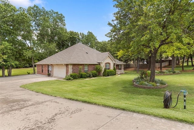 10650 Hunters Pointe, Edmond, OK 73034 - view of front of home featuring brick siding, an attached garage, a front lawn, and concrete driveway