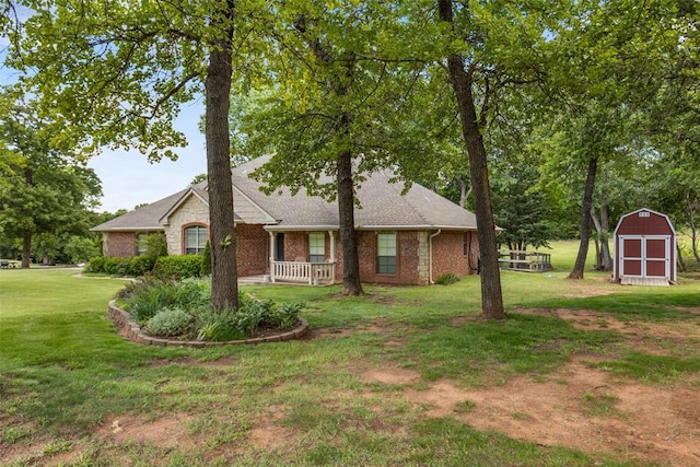 10650 Hunters Pointe, Edmond, OK 73034 - view of front of house with a front lawn, a porch, brick siding, and roof with shingles
