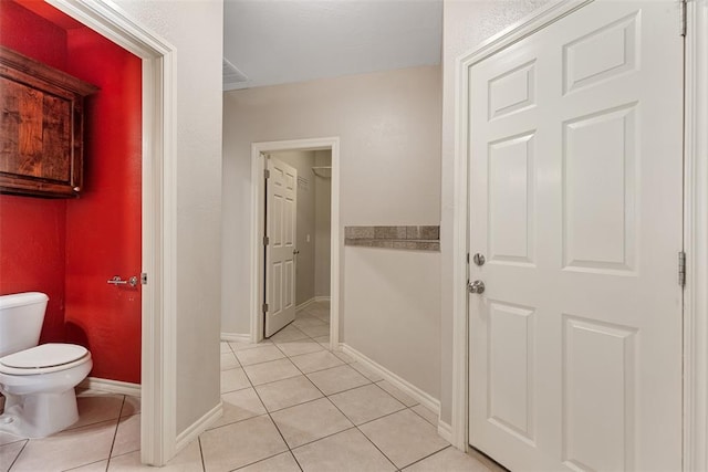 10650 Hunters Pointe, Edmond, OK 73034 - bathroom with toilet, tile patterned floors, and baseboards