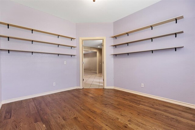 10650 Hunters Pointe, Edmond, OK 73034 - spare room with wood finished floors and baseboards