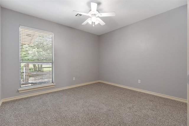 10650 Hunters Pointe, Edmond, OK 73034 - carpeted empty room with ceiling fan, baseboards, and healthy amount of natural light