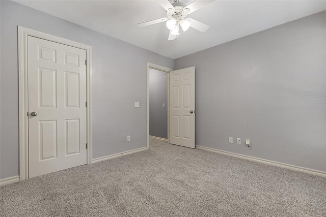 10650 Hunters Pointe, Edmond, OK 73034 - unfurnished bedroom featuring carpet, baseboards, and a ceiling fan