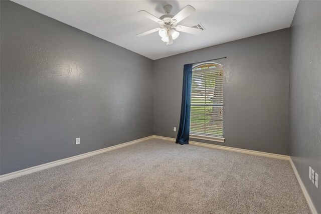 10650 Hunters Pointe, Edmond, OK 73034 - empty room featuring a ceiling fan, carpet flooring, and baseboards
