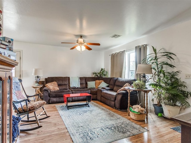 4900 S Post Rd, Oklahoma City, OK 73150 - living area featuring a ceiling fan and light wood-type flooring