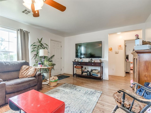 4900 S Post Rd, Oklahoma City, OK 73150 - living area featuring ceiling fan, wood finished floors, and baseboards