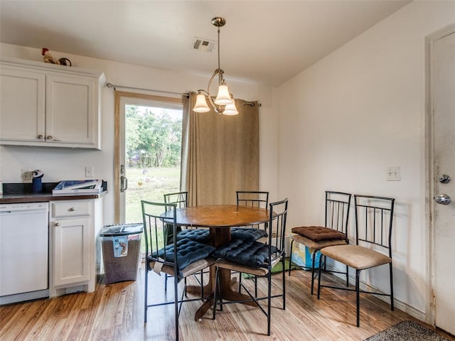 4900 S Post Rd, Oklahoma City, OK 73150 - dining area with a chandelier and light wood-type flooring