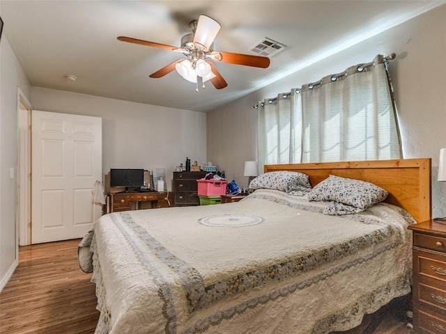 4900 S Post Rd, Oklahoma City, OK 73150 - bedroom featuring wood finished floors, a ceiling fan, and baseboards
