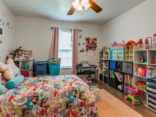 4900 S Post Rd, Oklahoma City, OK 73150 - bedroom with wood finished floors and a ceiling fan