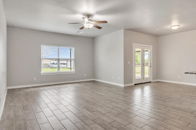 1330 Round Leaf Rd, Edmond, OK 73034 - spare room featuring ceiling fan and baseboards