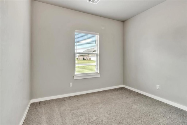 1330 Round Leaf Rd, Edmond, OK 73034 - carpeted spare room with baseboards