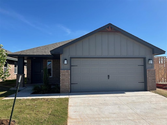 3008 NW 196th Pl, Edmond, OK 73012 - ranch-style house with brick siding, board and batten siding, driveway, an attached garage, and roof with shingles