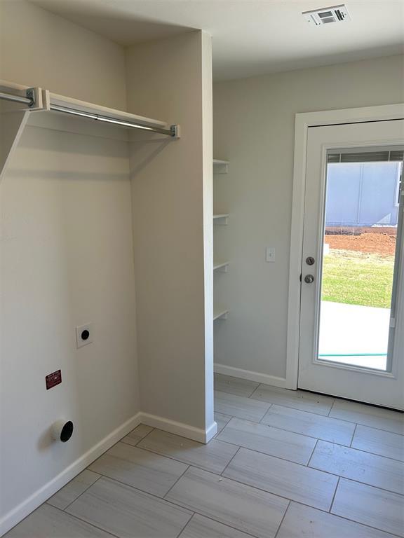 3008 NW 196th Pl, Edmond, OK 73012 - laundry room featuring hookup for an electric dryer and baseboards