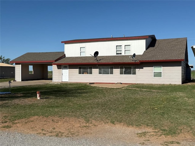 134 Wood St, Fort Cobb, OK 73038 - rear view of property featuring a yard, an attached carport, and roof with shingles