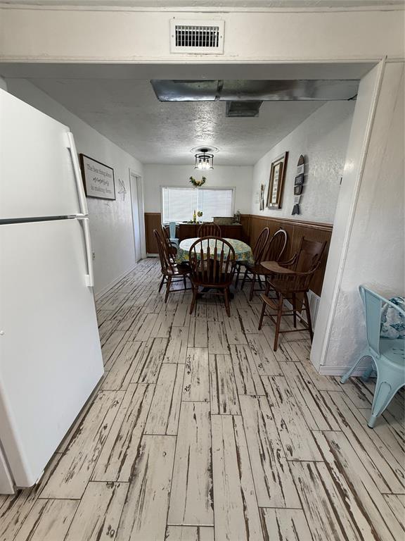 134 Wood St, Fort Cobb, OK 73038 - dining space with light wood-type flooring