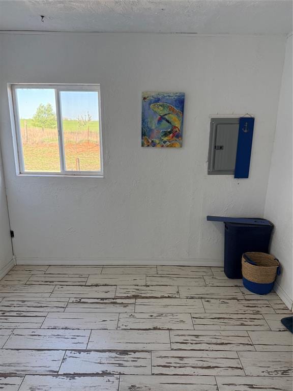134 Wood St, Fort Cobb, OK 73038 - empty room with electric panel and baseboards