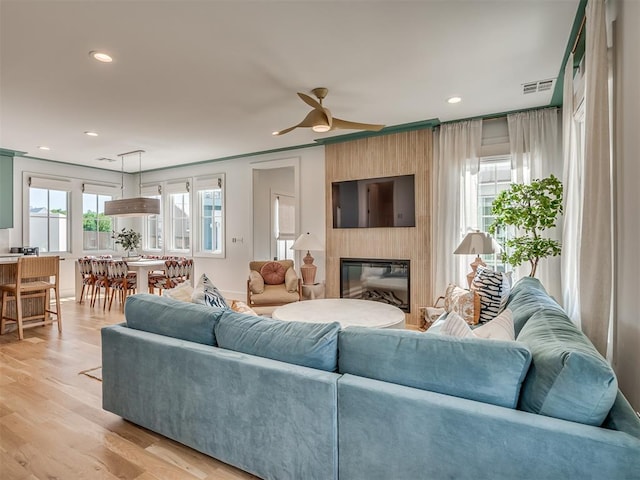 51 Lower Green Way, Carlton Landing, OK 74432 - living area with recessed lighting, a large fireplace, a ceiling fan, and light wood-type flooring