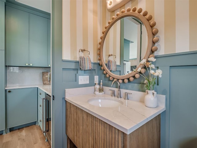 51 Lower Green Way, Carlton Landing, OK 74432 - bathroom featuring vanity, wood finished floors, and backsplash