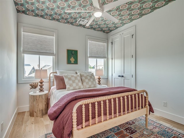 51 Lower Green Way, Carlton Landing, OK 74432 - bedroom with multiple windows, light wood-style floors, a closet, and baseboards