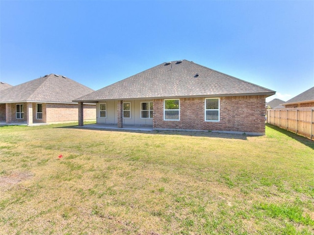1241 SW 139th St, Oklahoma City, OK 73170 - rear view of house with brick siding, a shingled roof, and a patio