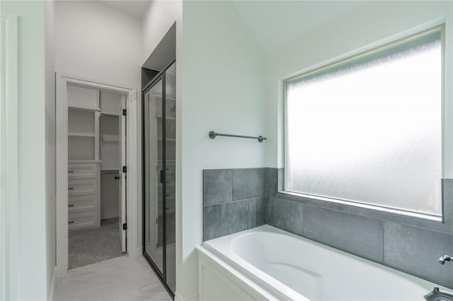 9217 SW 43rd St, Oklahoma City, OK 73179 - full bath with a bath, marble finish flooring, a walk in closet, a shower stall, and vaulted ceiling
