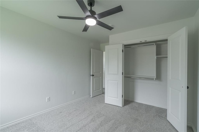 9217 SW 43rd St, Oklahoma City, OK 73179 - unfurnished bedroom featuring carpet flooring, baseboards, a closet, and a ceiling fan