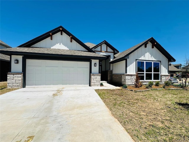 913 SW 141st St, Oklahoma City, OK 73170 - view of front of home featuring board and batten siding, driveway, a garage, and a shingled roof