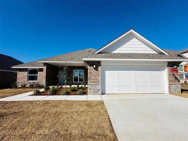 1209 SW 141st St, Oklahoma City, OK 73170 - single story home featuring a garage, driveway, a shingled roof, and brick siding
