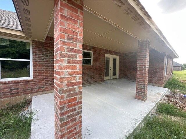 1233 SW 139th St, Oklahoma City, OK 73170 - view of patio / terrace featuring french doors