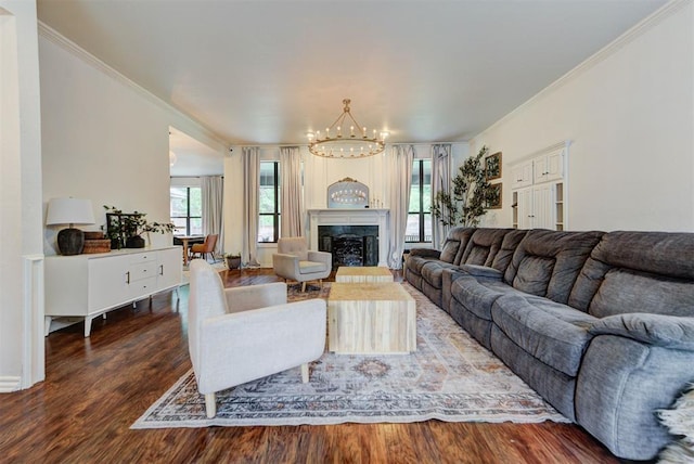 608 Shadow View Ct, Norman, OK 73072 - living room featuring a chandelier, wood finished floors, crown molding, and a fireplace