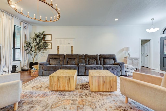 608 Shadow View Ct, Norman, OK 73072 - living area with a chandelier, wood finished floors, ornamental molding, recessed lighting, and baseboards