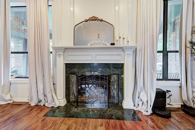 608 Shadow View Ct, Norman, OK 73072 - detailed view of wood finished floors, a tile fireplace, and baseboards