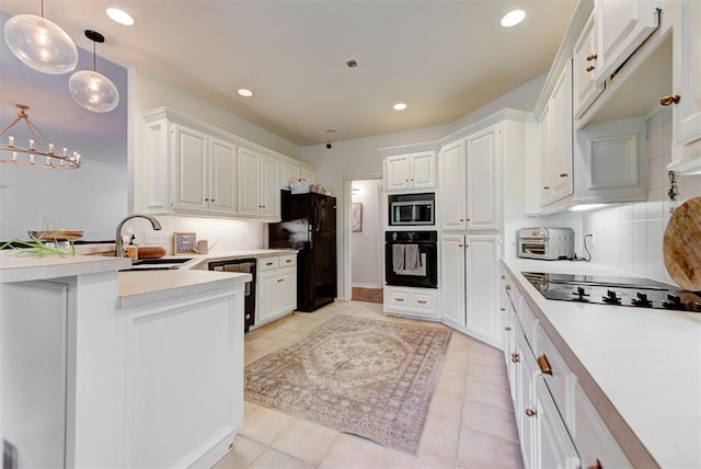 608 Shadow View Ct, Norman, OK 73072 - kitchen featuring black appliances, light countertops, a peninsula, white cabinets, and recessed lighting