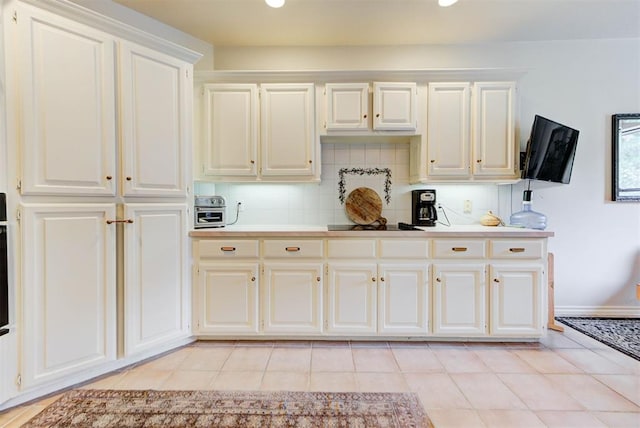 608 Shadow View Ct, Norman, OK 73072 - kitchen featuring light countertops, light tile patterned floors, white cabinets, and recessed lighting