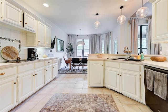 608 Shadow View Ct, Norman, OK 73072 - kitchen featuring dishwasher, a sink, light tile patterned flooring, light countertops, and decorative light fixtures