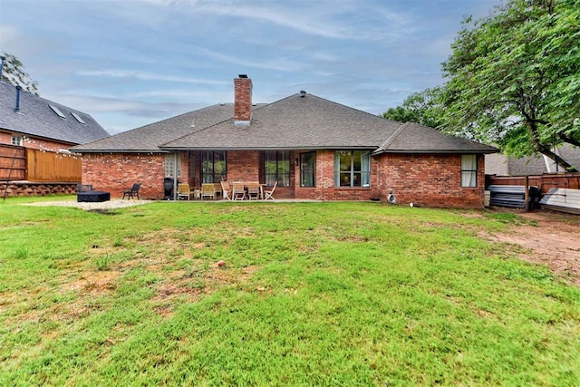 608 Shadow View Ct, Norman, OK 73072 - back of house featuring a chimney, brick siding, a patio area, and a shingled roof