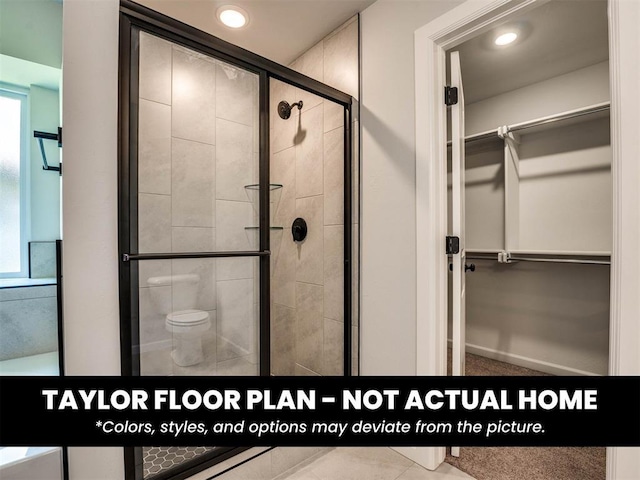 8509 NW 76th St, Oklahoma City, OK 73132 - bathroom with a spacious closet, a shower stall, toilet, and recessed lighting