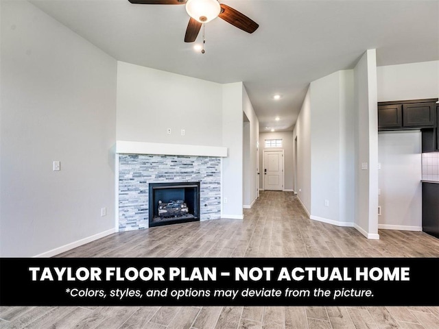 8509 NW 76th St, Oklahoma City, OK 73132 - unfurnished living room featuring a ceiling fan, light wood-type flooring, baseboards, and a tile fireplace