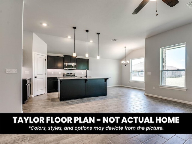 8509 NW 76th St, Oklahoma City, OK 73132 - kitchen featuring stainless steel appliances, lofted ceiling, a chandelier, light wood-style flooring, and a ceiling fan