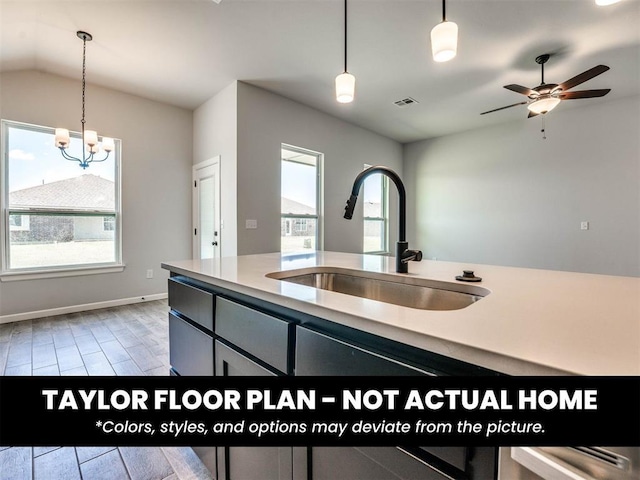 8509 NW 76th St, Oklahoma City, OK 73132 - kitchen with a sink, decorative light fixtures, a chandelier, a ceiling fan, and light countertops