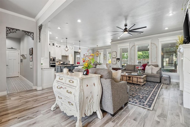 4813 Hambletonian Ln, Mustang, OK 73064 - living area with ceiling fan, baseboards, light wood finished floors, recessed lighting, and ornamental molding