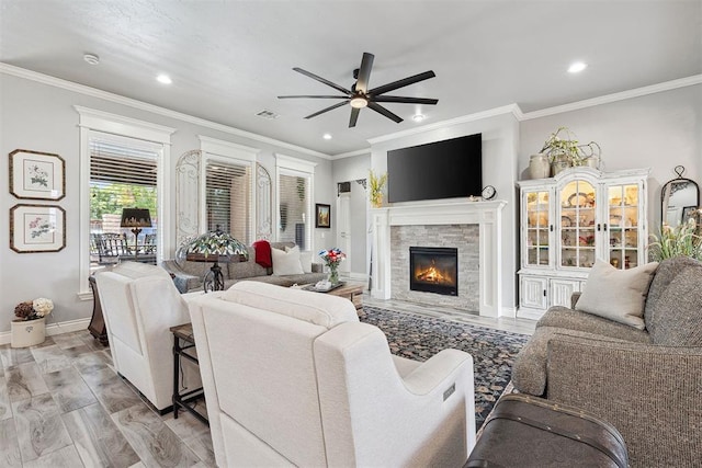 4813 Hambletonian Ln, Mustang, OK 73064 - living room with ceiling fan, a fireplace, ornamental molding, recessed lighting, and baseboards