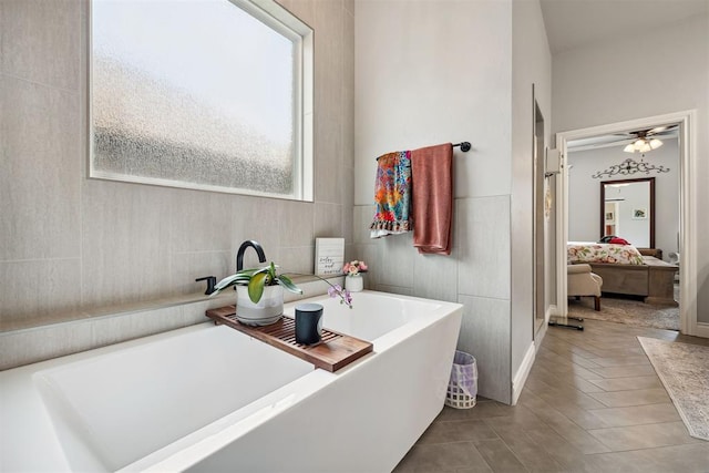 4813 Hambletonian Ln, Mustang, OK 73064 - ensuite bathroom with a tub to relax in and a ceiling fan