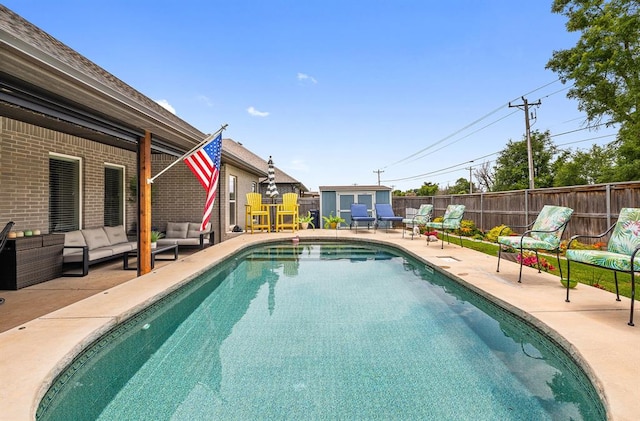 4813 Hambletonian Ln, Mustang, OK 73064 - view of swimming pool with an outdoor living space, a patio, and a fenced backyard