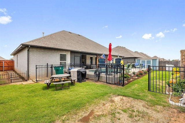 4813 Hambletonian Ln, Mustang, OK 73064 - back of house featuring brick siding, roof with shingles, and an outdoor structure